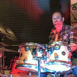 drummer playing to coronavirus song sidebyside